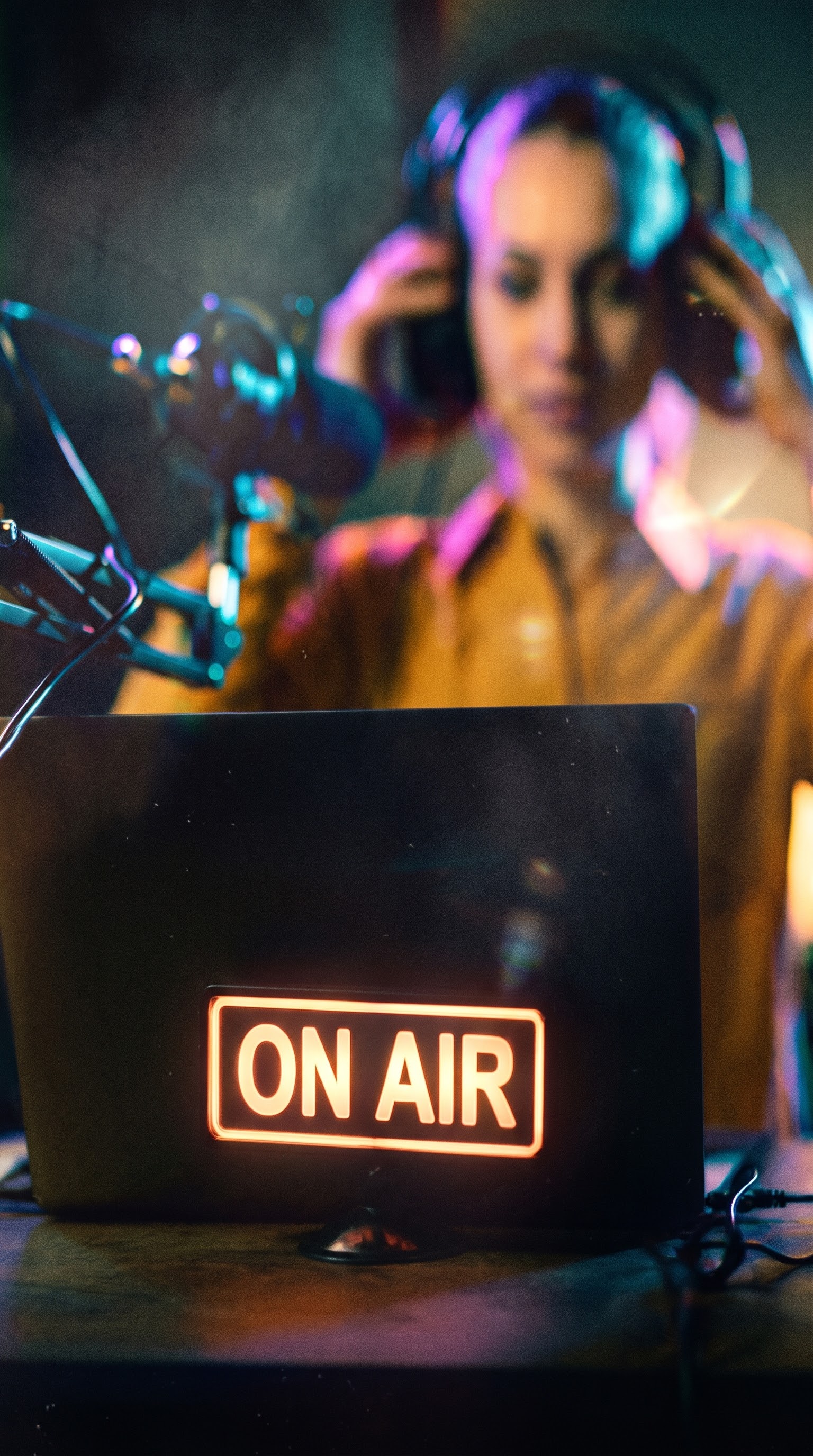 Studio microphone in a dark broadcast studio