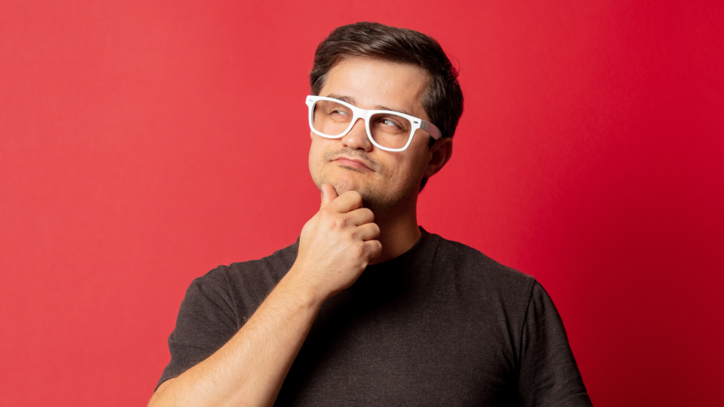 man thinking with white glasses on